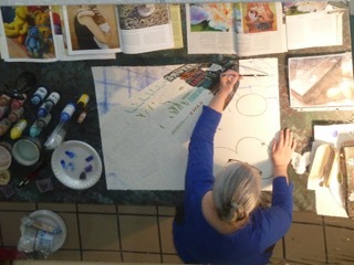 Deb begins work on her painting